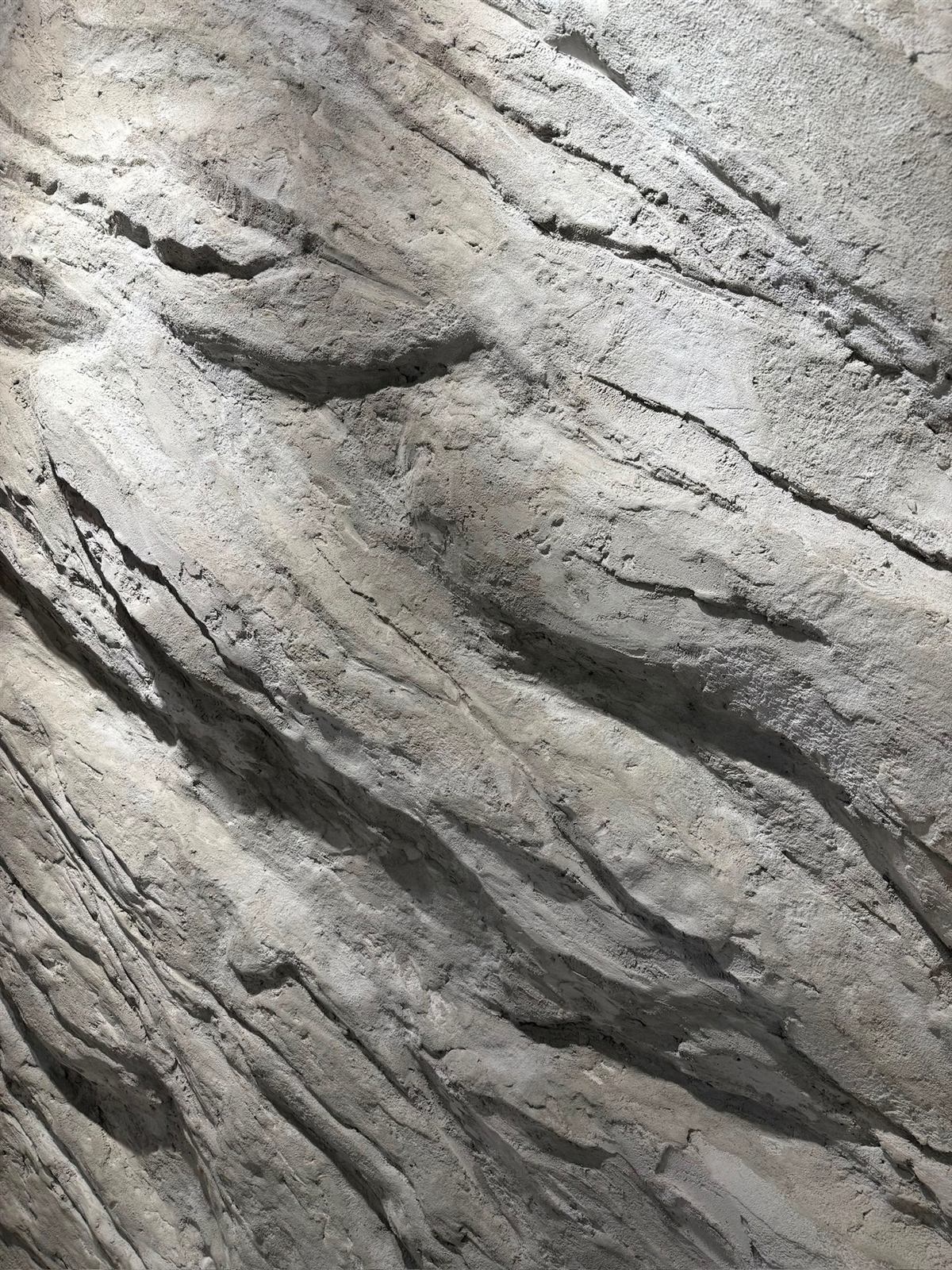 Close-up of a hand-sculpted Stone Craft wall